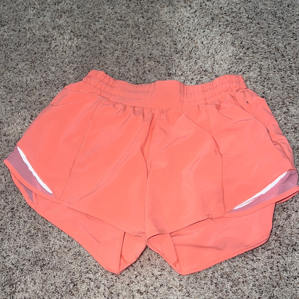 Lululemon athletic shorts size 6, 4 inch, coral/pink color shorts.